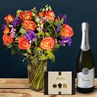 Bloom Magic - Flower Delivery Ireland - A lovely orange and purple bouquet featuring mango cala and mini gerbera. These flowers are classic and timeless and can be sent for any occasion. This tasteful arrangement is available for same-day delivery in Dublin and next-day flower delivery to all of Ireland.