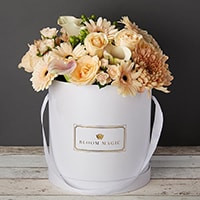 Bloom Magic - Flower Delivery Ireland - This bouquet screams white, and would brighten up any home or day. This arrangement comes in a pearl white, or matte black hatbox. It features white calla lilies, and white roses, that are hand tied by some of the country's top florists. Same day delivery is available in Dublin, and next day delivery is available to anywhere in Ireland.