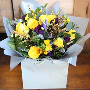 Bloom Magic - Flower Delivery Ireland - This bouquet offers sunny yellow and rich purple flowers that make it a particularly expresiive summer flower arrangement. The Gaia bouquet is lively and happy and sure to delivery a smile. Next day delivery Ireland is available.