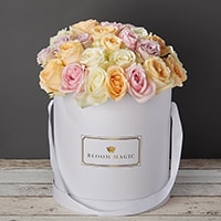 Bloom Magic - Flower Delivery Ireland - This arrangement contains a mix of some of the highest quality roses you can find anywhere in Ireland. The flowers are handtied and beautifully presented in a matte black and pearl white hat box. These roses are the perfect gift for any romantic occasion, whether it is wedding flowers, valentines flowers, or even birthday flowers. The person who opens their door when the flowers are delivered will be delighted with this beautifully presented gift.
