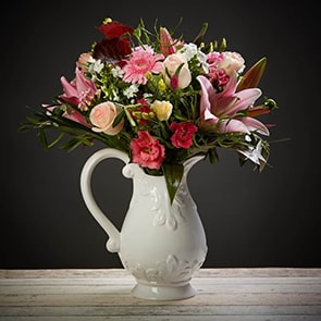 Bloom Magic - Flower Delivery Ireland - A beautiful, gentle and feminine combination of powdery and hot pinks give this bouquet a special appeal. Perfect to celebrate a Baby girl's arrival or sweet as a romantic gesture. This bouquet features roses, lilies, lisianthus and gerbera, as well as gorgeous mix of seasonal bloom. This bouquet is available for flower delivery Dublin and flower delivery Ireland and satisfaction is alway guaranteed.