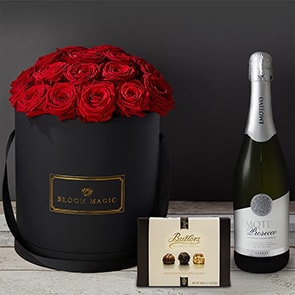 Bloom Magic - Flower Delivery Ireland - This hatbox flower arrangement features stunning red roses immaculately arrange and presented in a choice of either a matte black or pearl white large hatbox. this arrangement is the perfect gift, especially if you are looking for some Valentines flowers to make that someone special feel amazing. We offer same day delivery for this arrangement to anywhere in Dublin, and next day delivery to anywhere in Ireland.