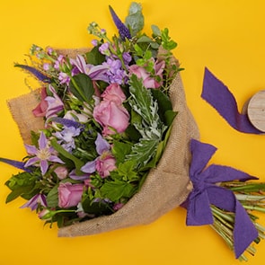 Bloom Magic - Flower Delivery Ireland - This suble and charming bouquet of flowerr, featuring pink roses, veronica and clematis is a perennial favourite with our customers. These flowers tell a love story: soft blues, muted lilacs and deep purples are beautifully combined by our expert florists.