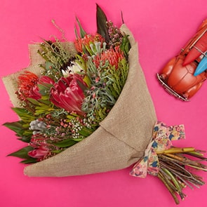 Bloom Magic - Flower Delivery Ireland - A unique bouquet of proteas, nutans and kaaps green. This bouquet will brighten any day and is sure to put a smile on the recipient's face. A perfect gift of birthday flowers or thank-you flowers. Flower delivery Ireland is available for order now. 