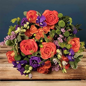 Bloom Magic - Flower Delivery Ireland - A lovely orange and purple bouquet featuring mango cala and mini gerbera. These flowers are classic and timeless and can be sent for any occasion. This tasteful arrangement is available for same-day delivery in Dublin and next-day flower delivery to all of Ireland.