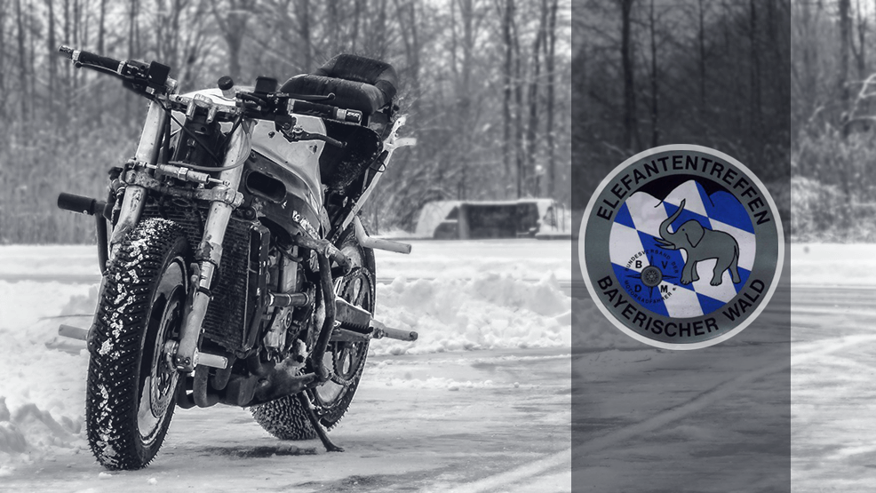 Moto stunt en la nieve y logo de la Elefantentreffen Moto stunt en la nieve