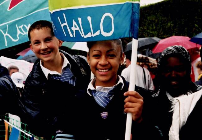 Local children welcoming the Olympic flame to Merton