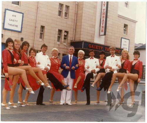 Photograph - 1984 Gaiety Whirl - performers and dancers shown outside the Gaiety Theatre building Photograph - 1984 Gaiety Whirl - performers and dancers shown outside the Gaiety Theatre building
