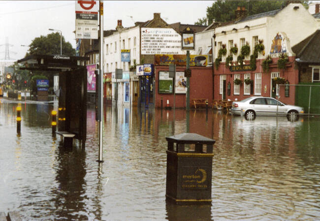 Flooding in Colliers Wood, Underground Station and the Royal  Standard pub