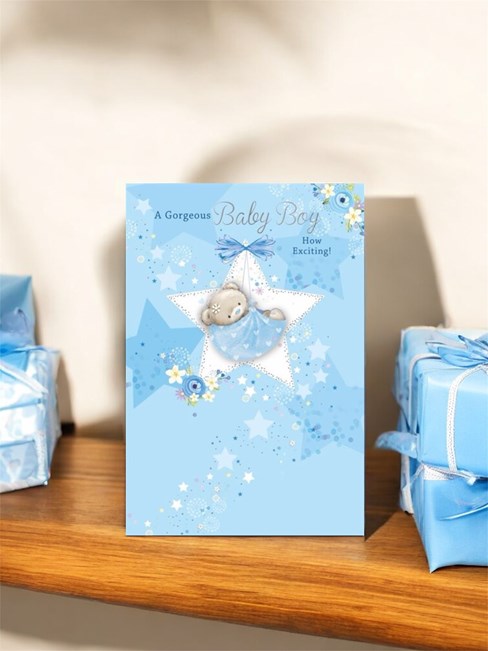 Birth of New Baby Boy Card - White Star with Teddy in Blue Hammock 7.75x5.25" Birth of New Baby Boy Card - White Star with Teddy in Blue Hammock 7.75x5.25"