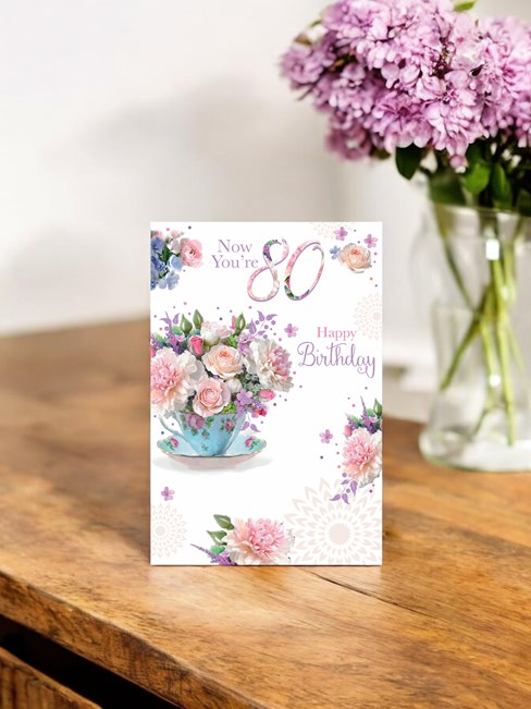 Age 80 80th Birthday Card - Pink Flowers in Teacup with Glitter 7.75" x 5.25" Age 80 80th Birthday Card - Pink Flowers in Teacup with Glitter 7.75" x 5.25"