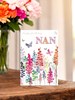 Nan Birthday Card - Pink Lilac Orange Flowers Butterfly Silver Foil  7.75x5.25"