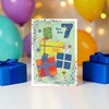 7th Birthday Card - Age 7 Multicoloured Presents & Stars Silver Foil 7.75x5.25"