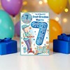 Great Grandson 7th Birthday Card & Badge - Boy on Scooter with Blue Foil 9x6"