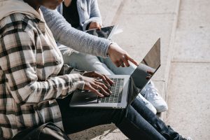 pointing at laptop screen