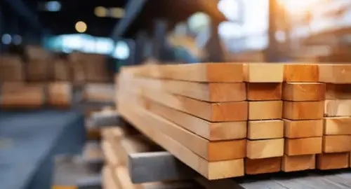 Preservative treated timber panels on a palatte in a yard.