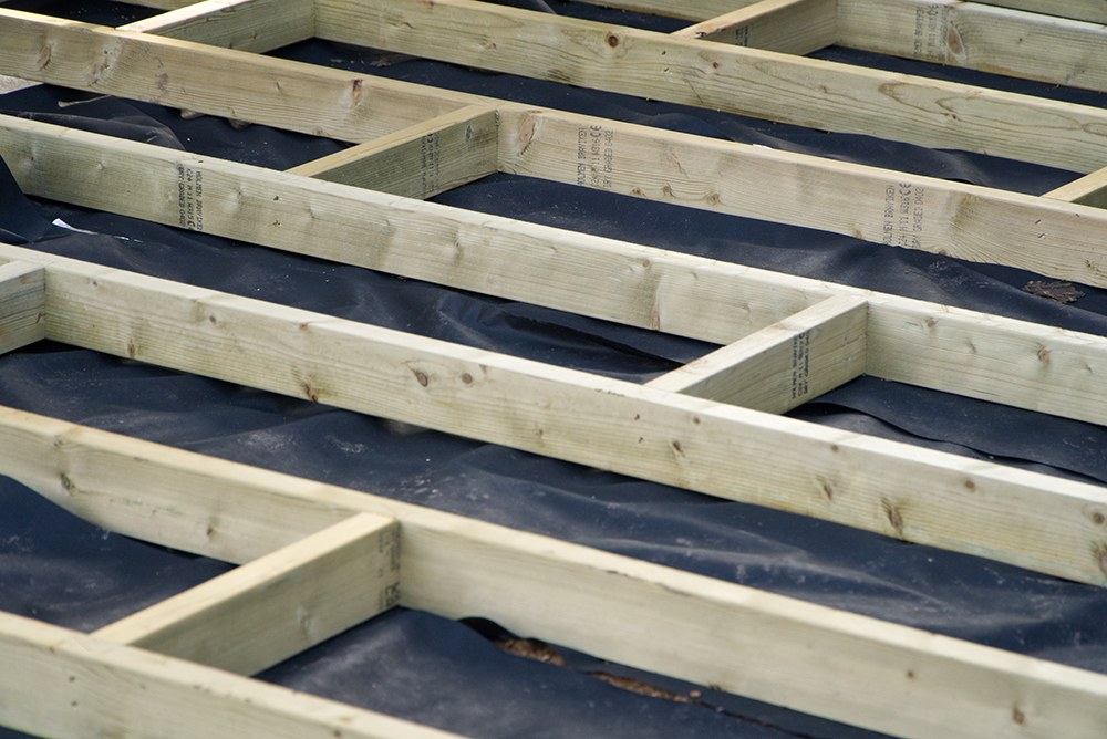 An image of a joists and noggins laying on a membrane ready for decking to be added