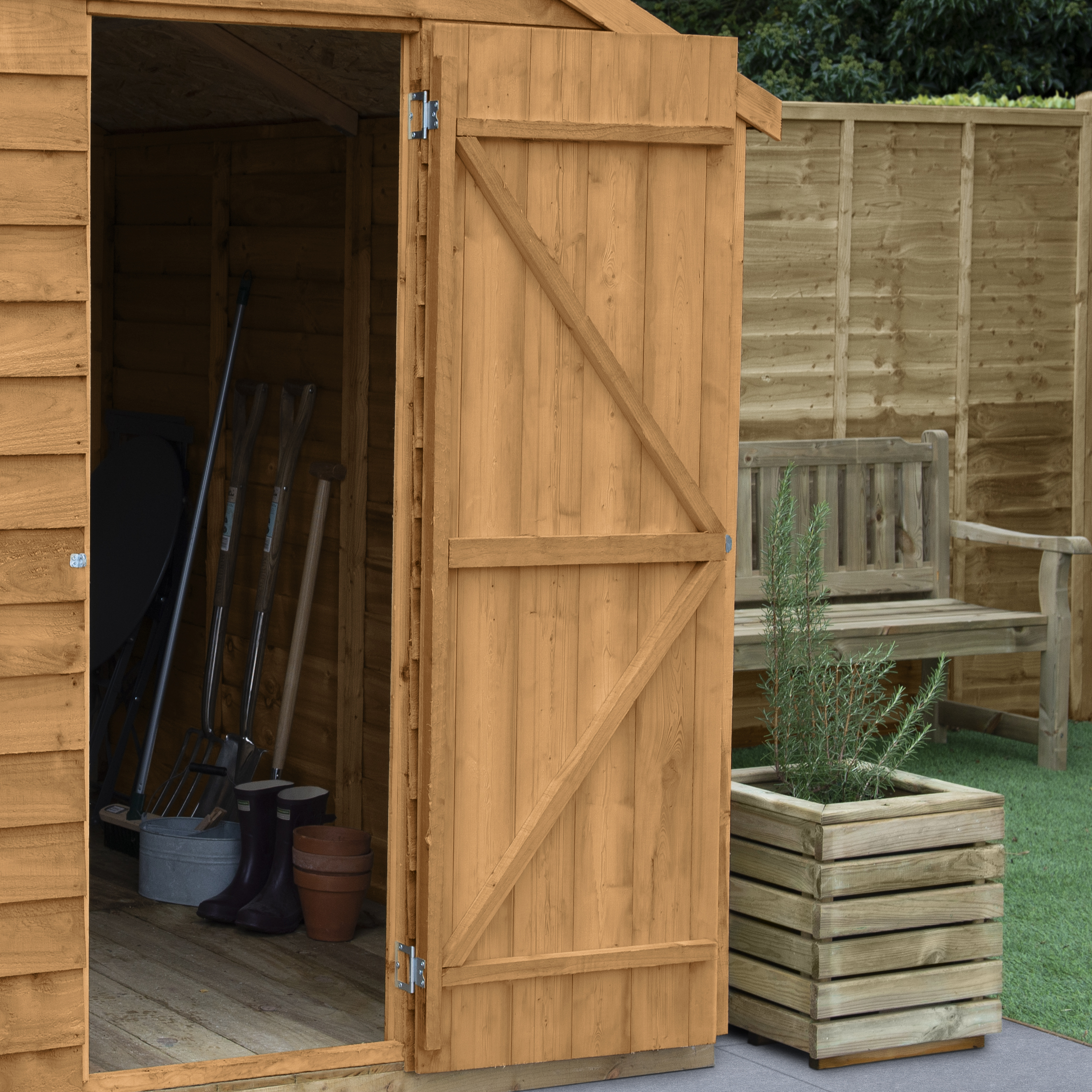 A garden shed situated outside in a garden, perfect for storage.