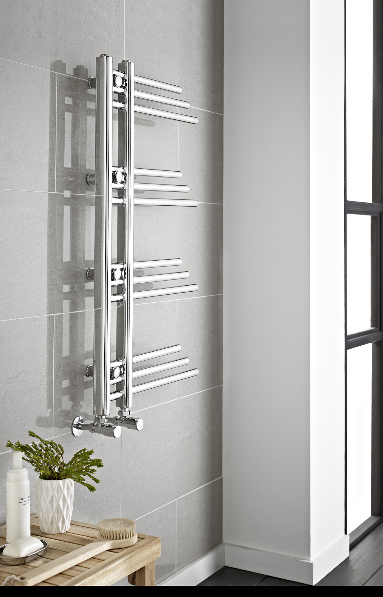 an image of a towel rail valve in a bathroom against a wall. an image of a towel rail valve in a bathroom against a wall.