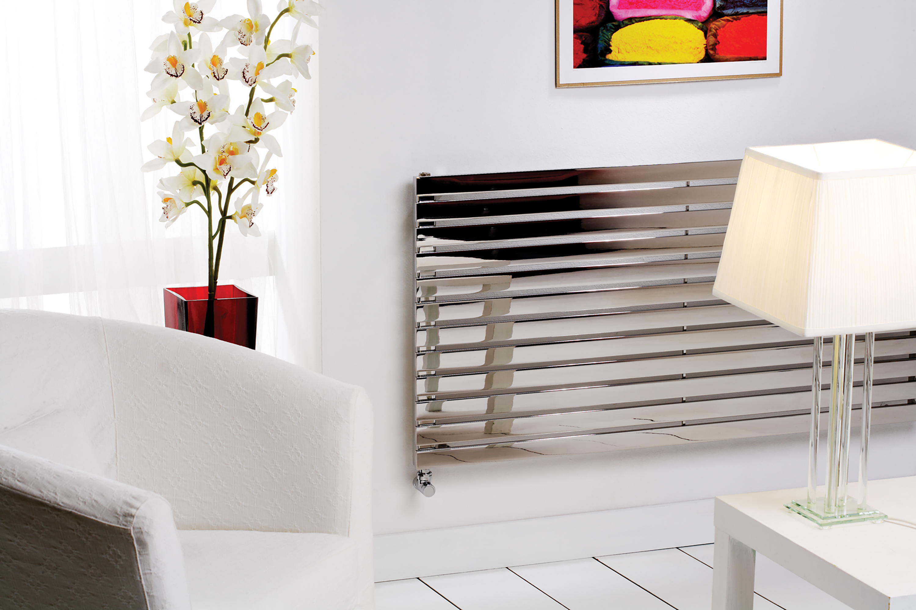 an image of a straight horizontal chrome towel rail with a chair.. an image of a straight horizontal chrome towel rail with a chair..