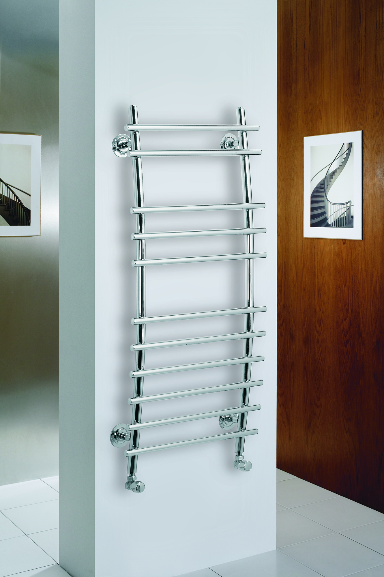 an image of a stainless steel towel rail in a white bathroom. an image of a stainless steel towel rail in a white bathroom.