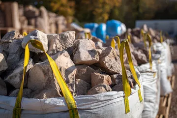 Image of blocks of concrete in a bulk bag, ready to be used for construction projects.
