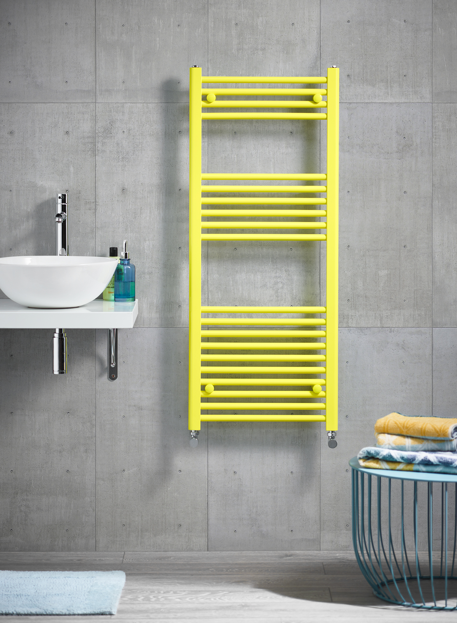 A yellow painted radiator in a home setting