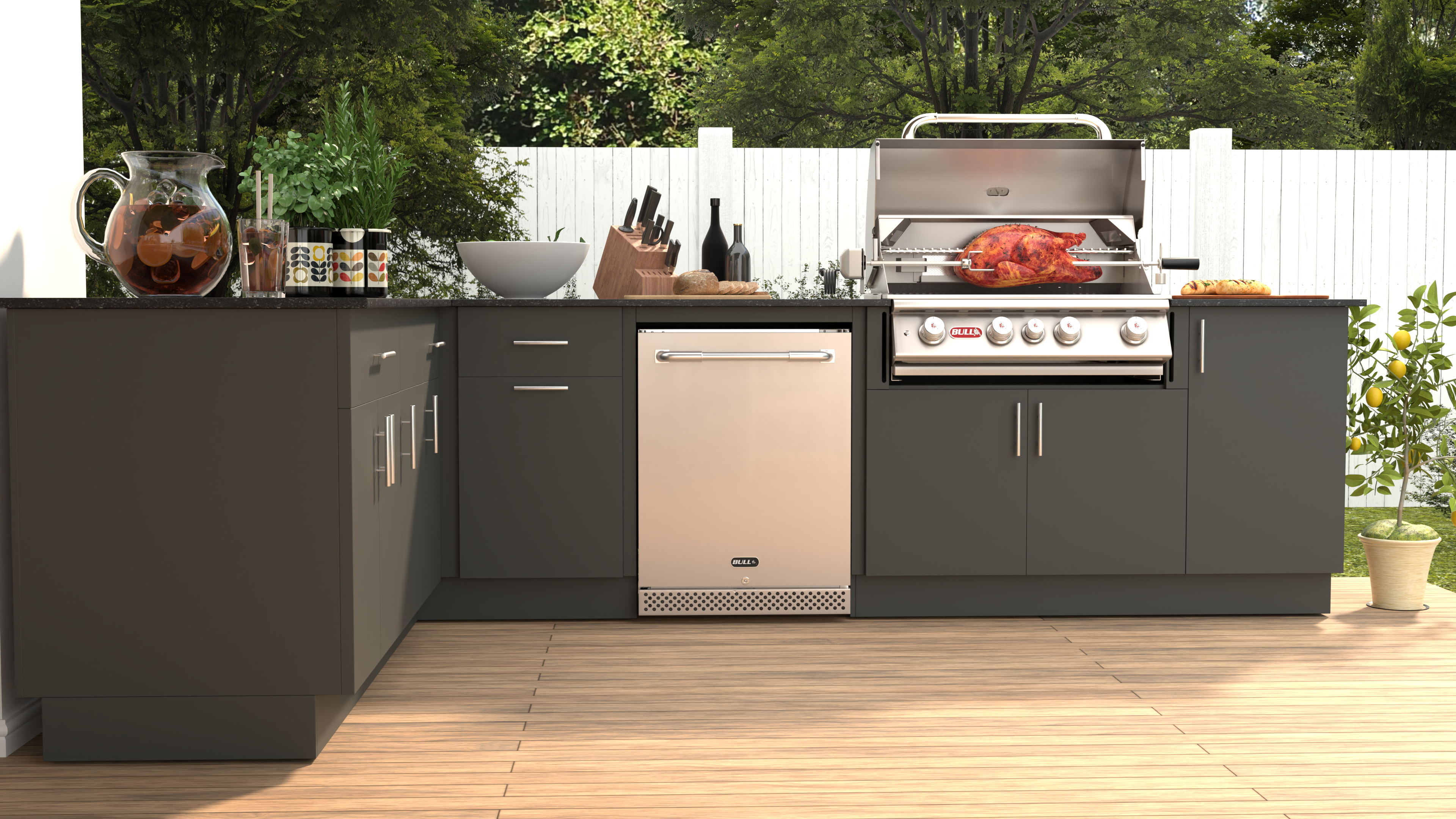An integrated bbq in an outdoor kitchen in a small garden.