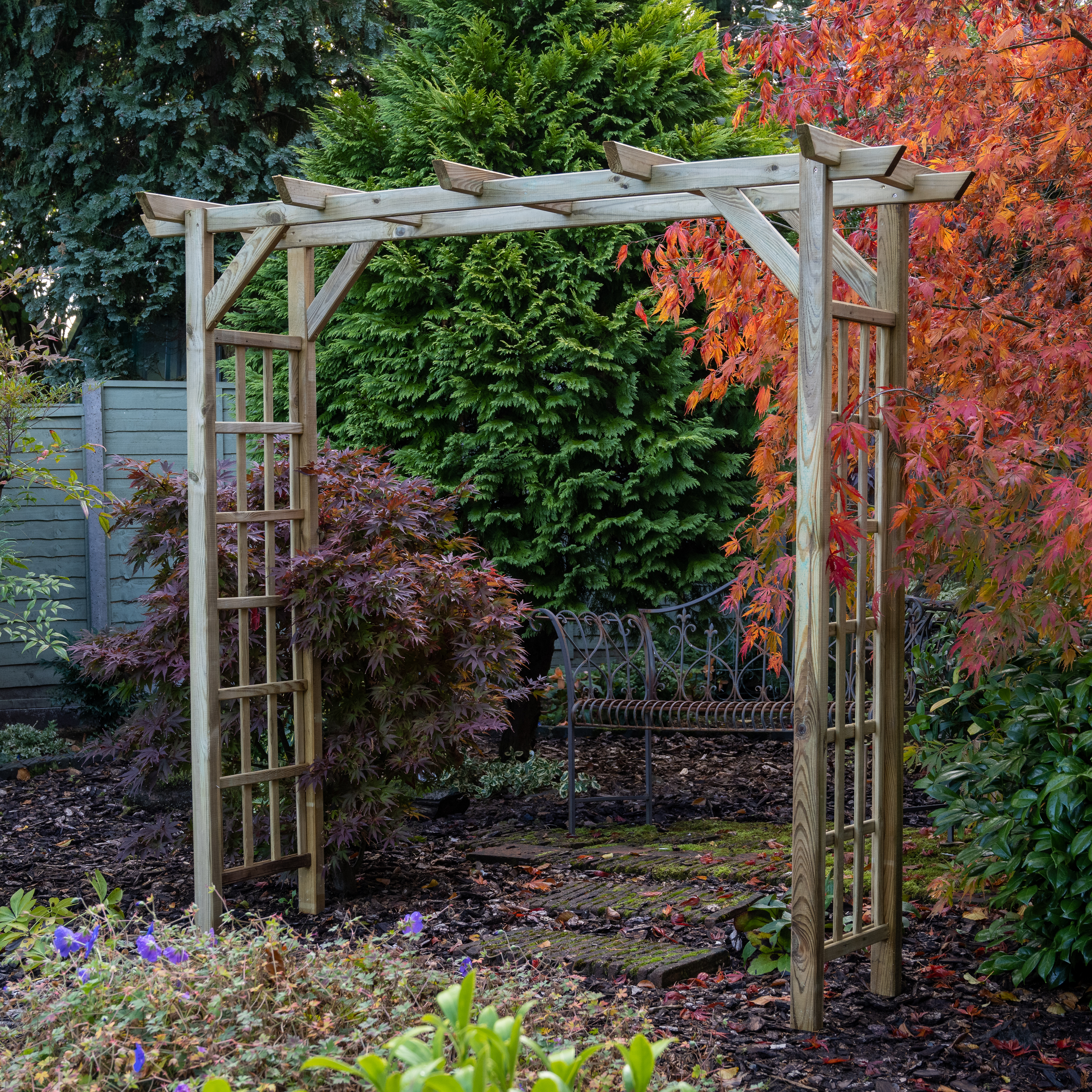 Pergolas used at the end of a garden path to highlight an area of the garden.