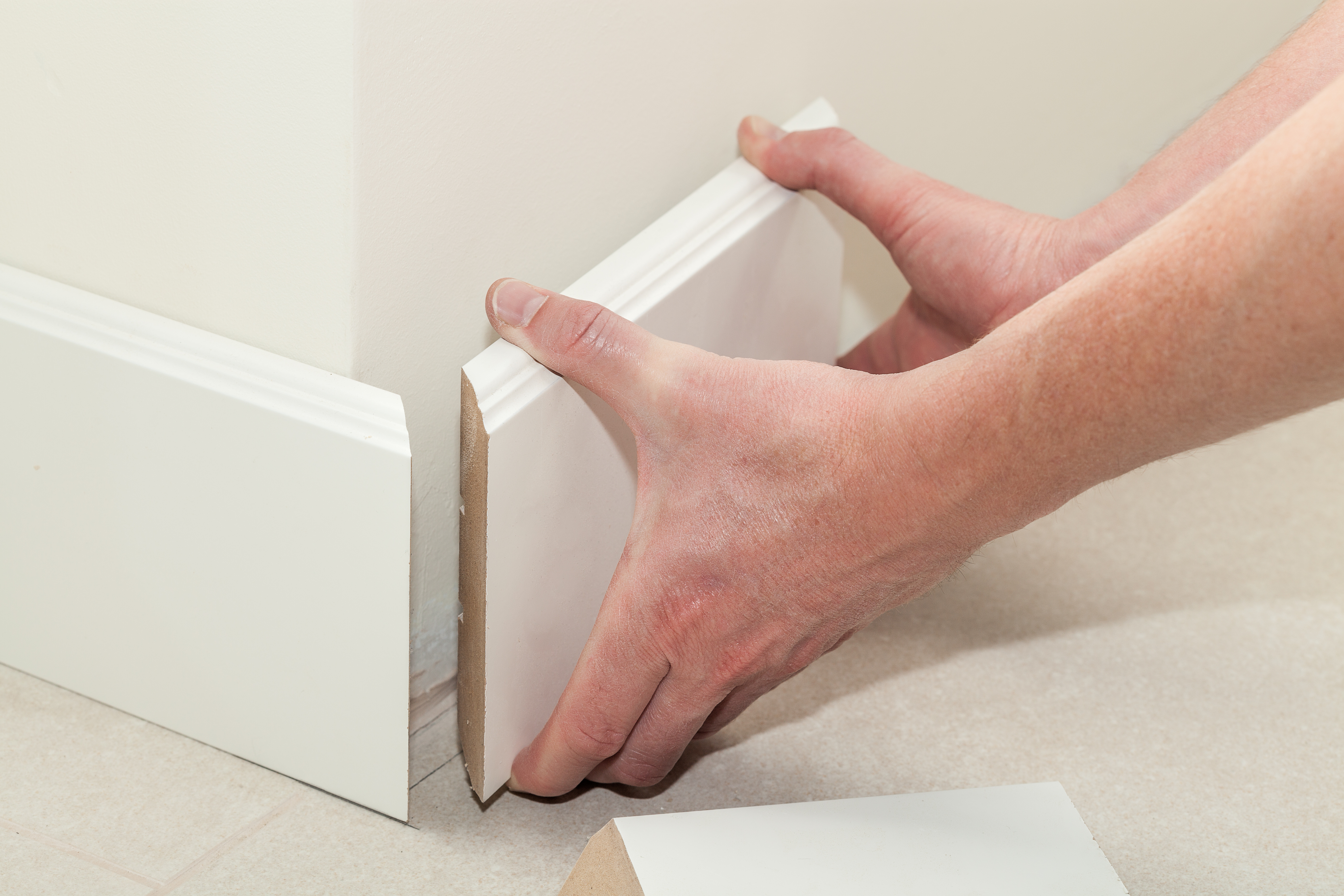 an image of a mitre cut being used against skirting boards