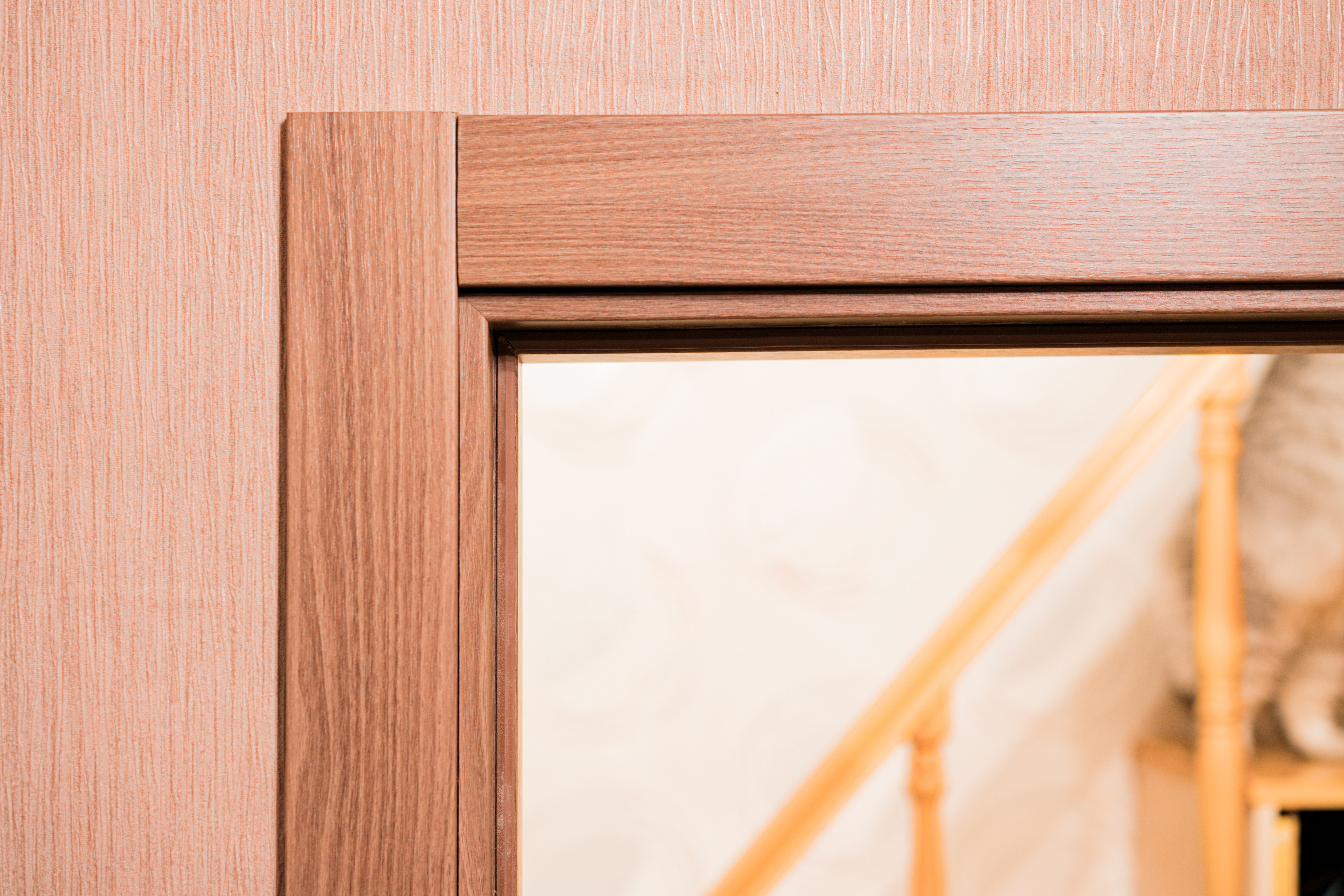 dark brown and white wooden door architrave