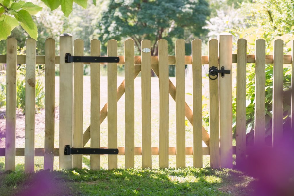 wooden gate outside of a cottage home