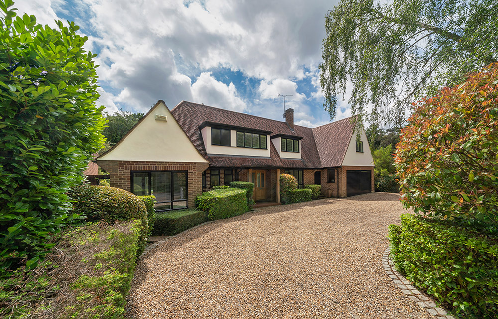 A stone chipping driveway, showcasing a clean and elegant surface that enhances the modern aesthetic of the home.