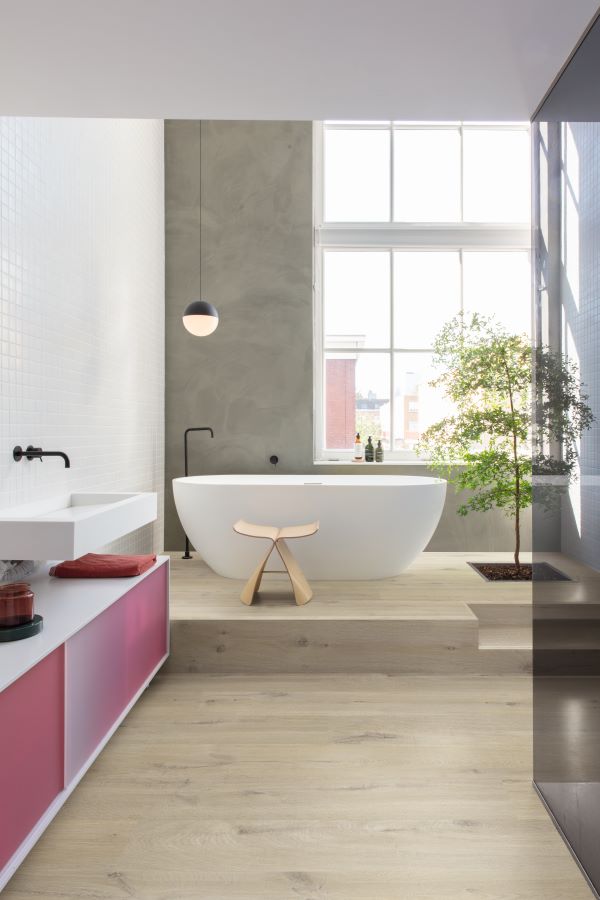 an image of some grey laminate flooring alongisde grey kitchen cupboards
