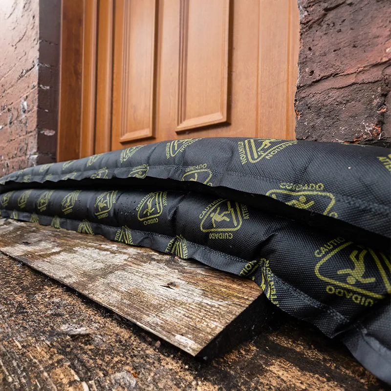 Floodshield Osmo absorbent flood barrier being used against the front door of a house.