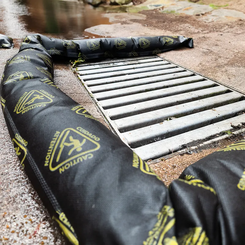 A close up of the floodshield absorbent flood barrier, covered around a grate.