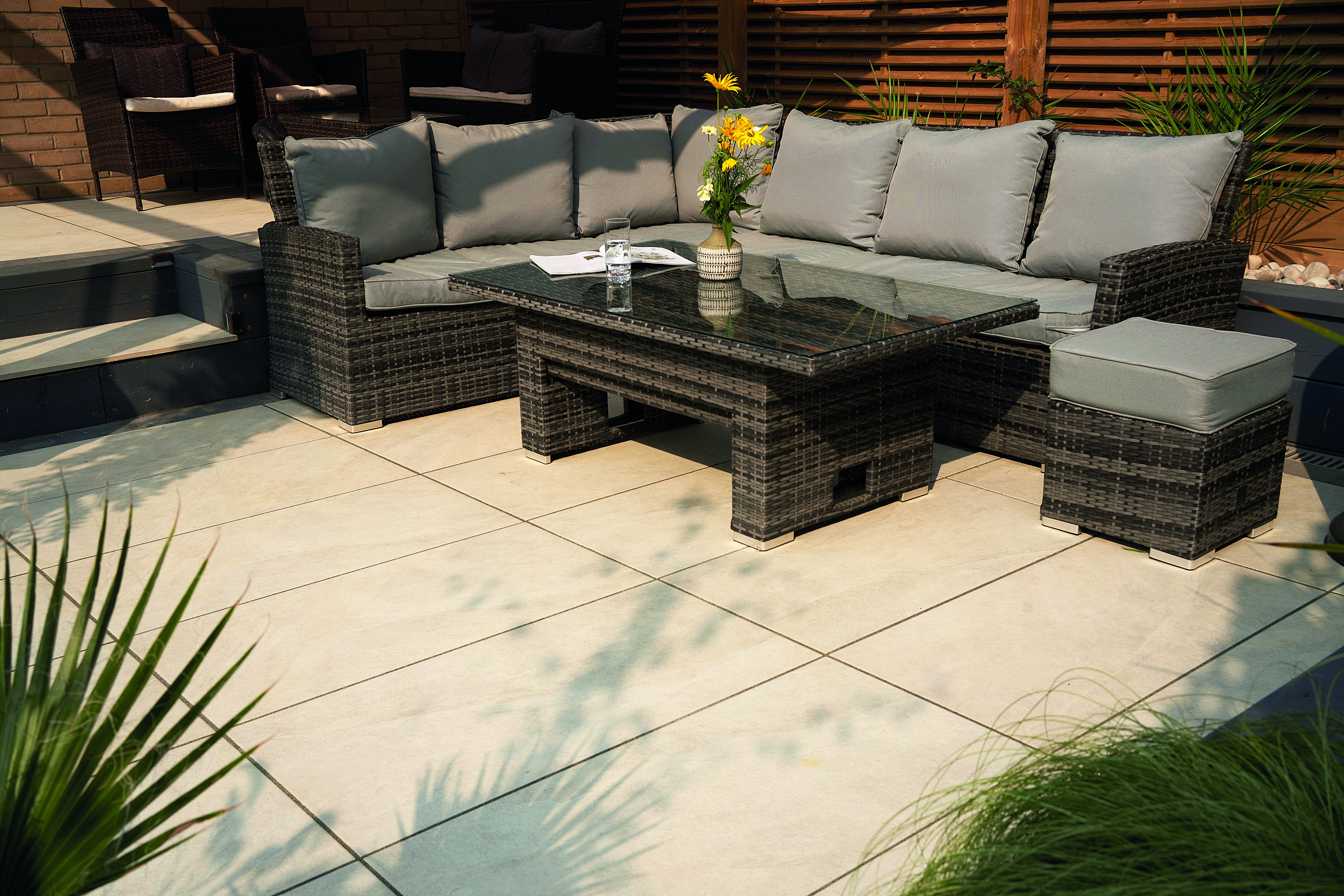 Beige porcelain paving used in an outside area. 
