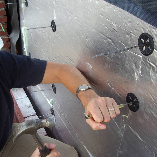 an image of a bricked house with Celotex insulation being installed an image of a bricked house with Celotex insulation being installed