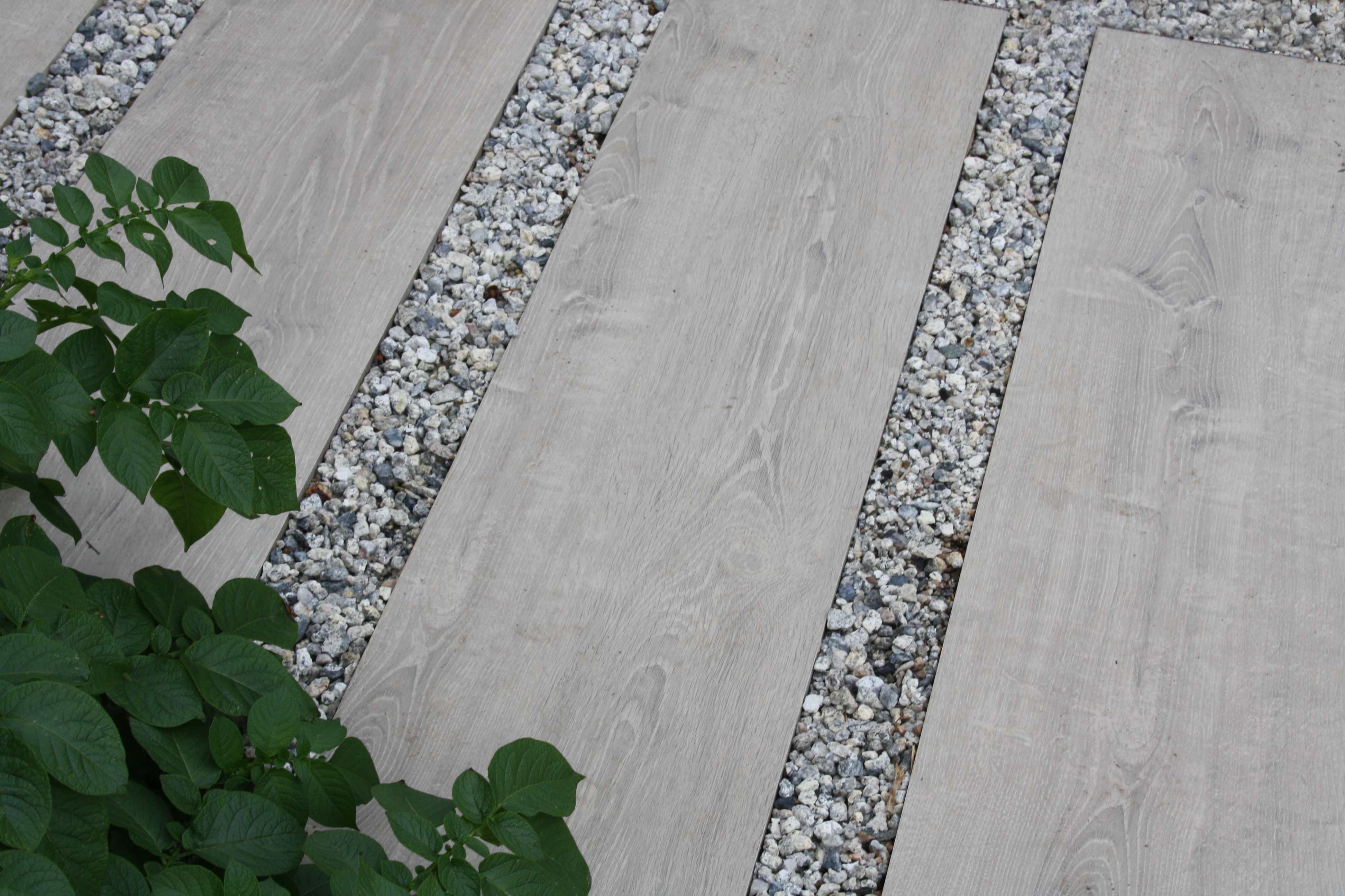 Decorative stones are hugely popular right now for gardens, and they make the perfect option for garden paths.