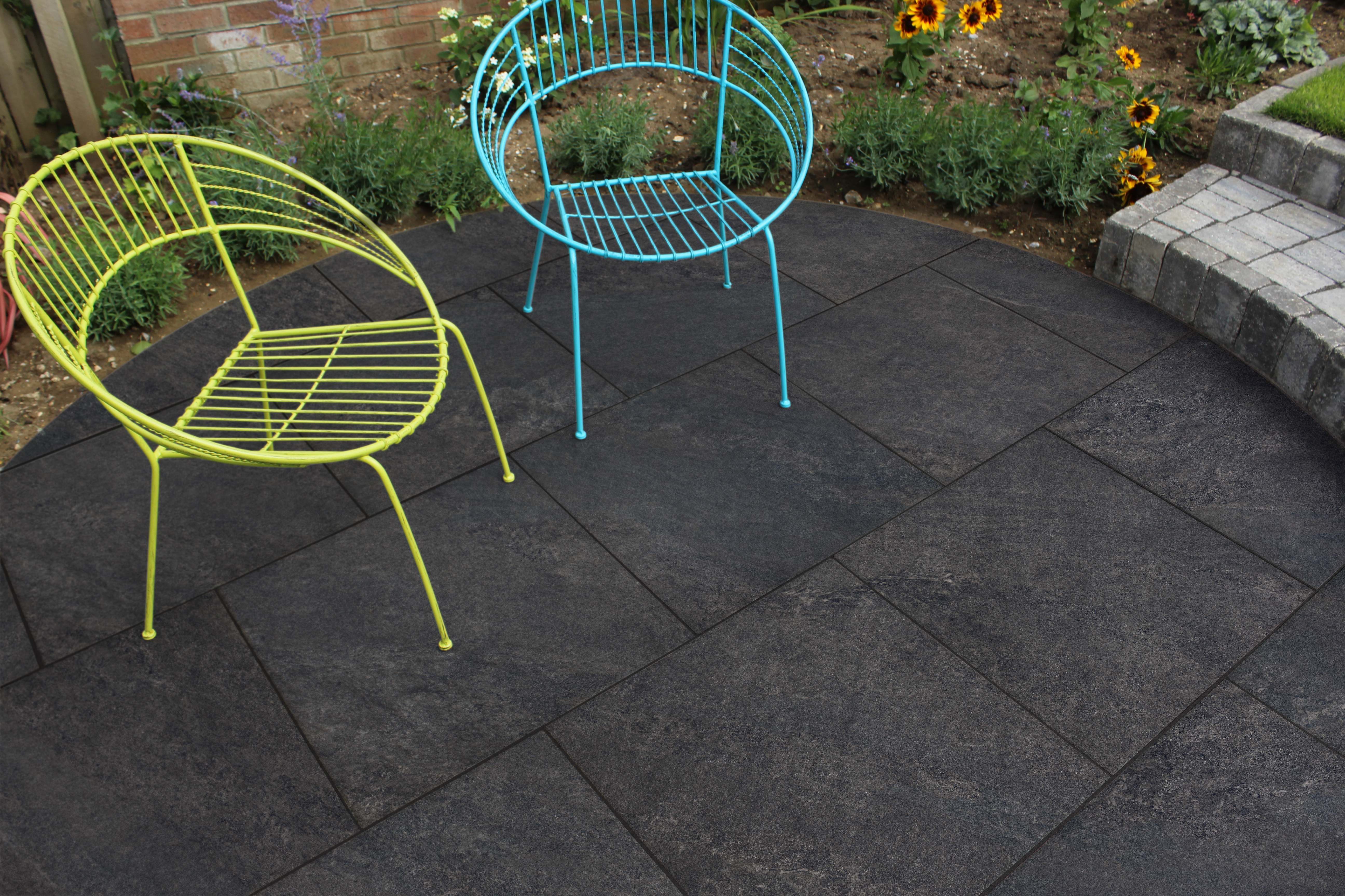 Black porcelain paving being used in an outside area. 