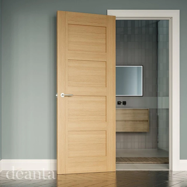 A light brown, oak internal fire door opening to reveal a bathroom space. A light brown, oak internal fire door opening to reveal a bathroom space.
