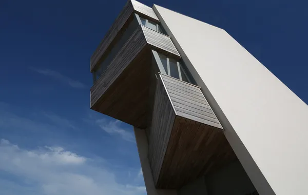 Cladding being used as part of a very tall, modern building.