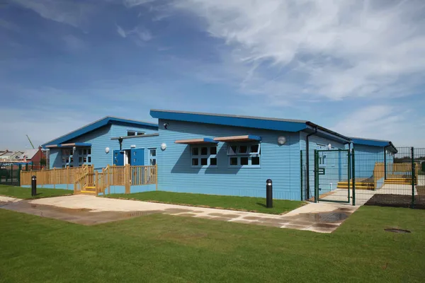 Cladding used in the colour of blue to create a bright, wholesome home.