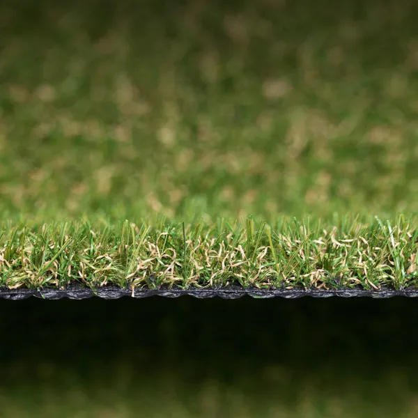 a close up picture of some dark artificial grass laid in a garden. a close up picture of some dark artificial grass laid in a garden.