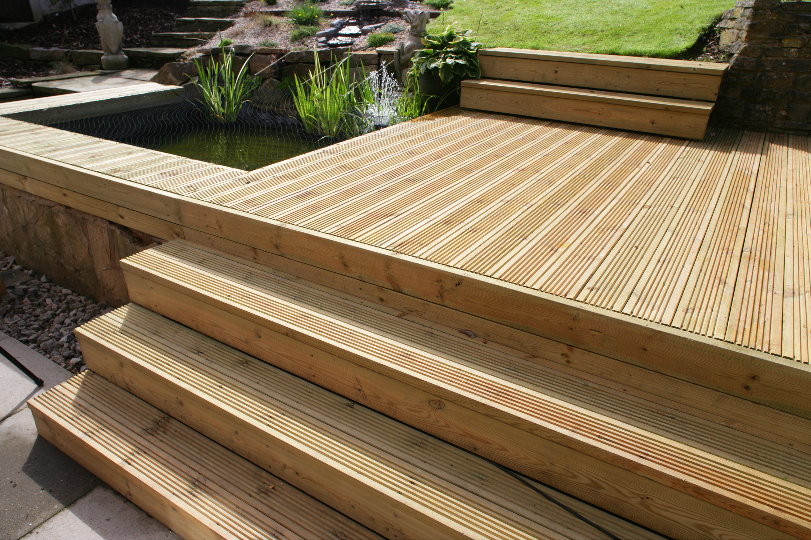 A completed deck attached to the outside of a house. 