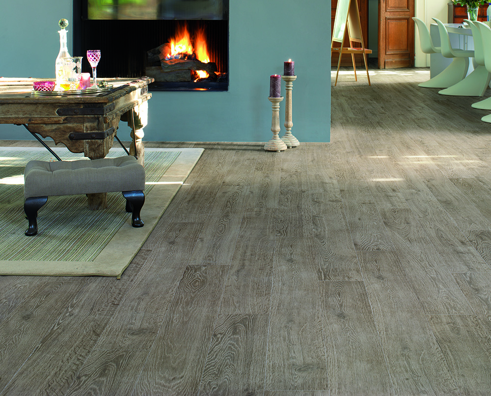 an image of men fitting laminate flooring together to be fitted