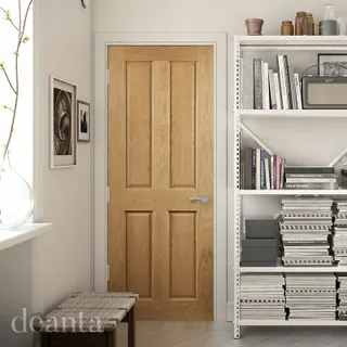Image of a caramel coloured door in a study of a house, with bookshelfs surrounding it. Image of a caramel coloured door in a study of a house, with bookshelfs surrounding it.