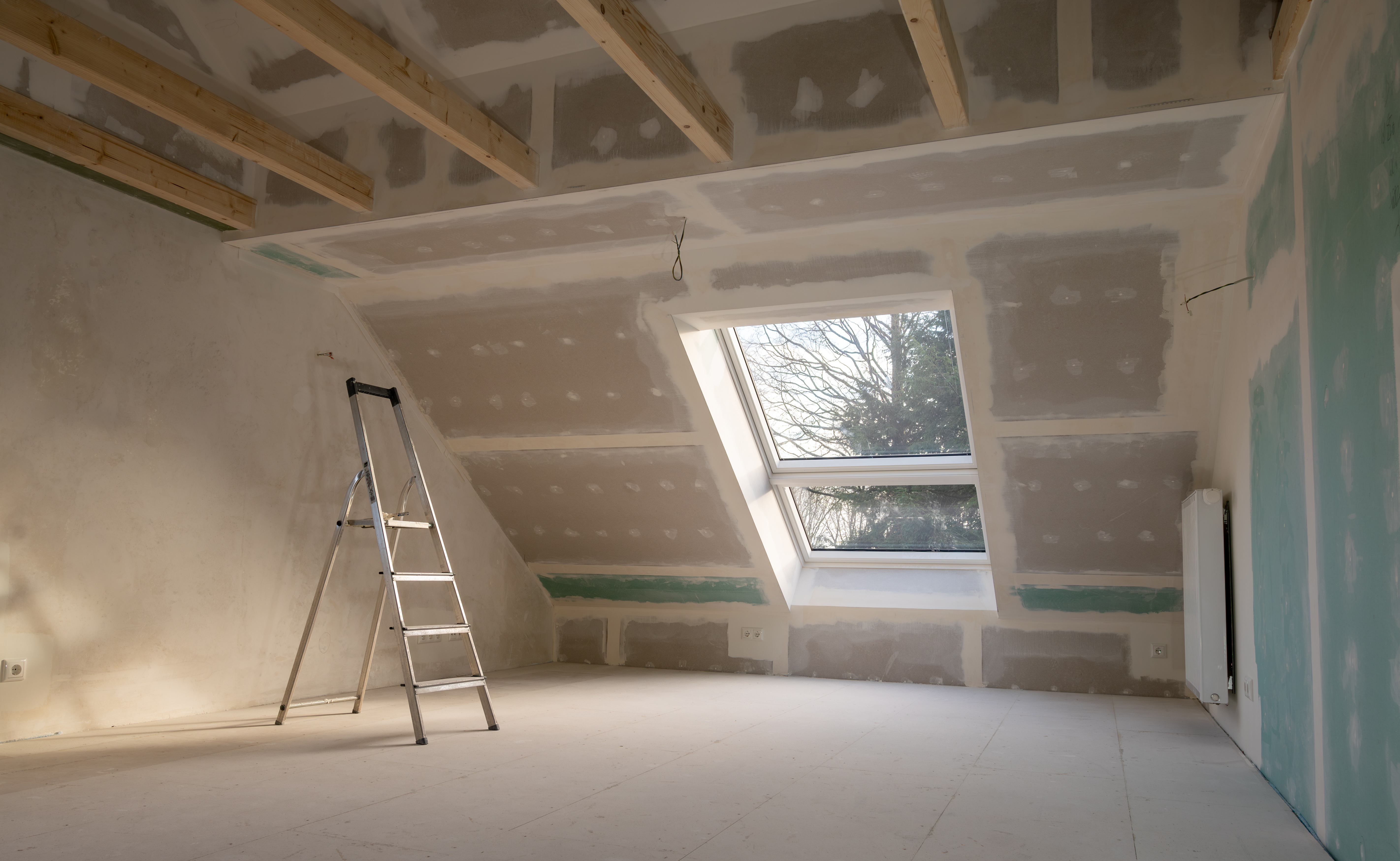an image of a newly plasterboarded wall