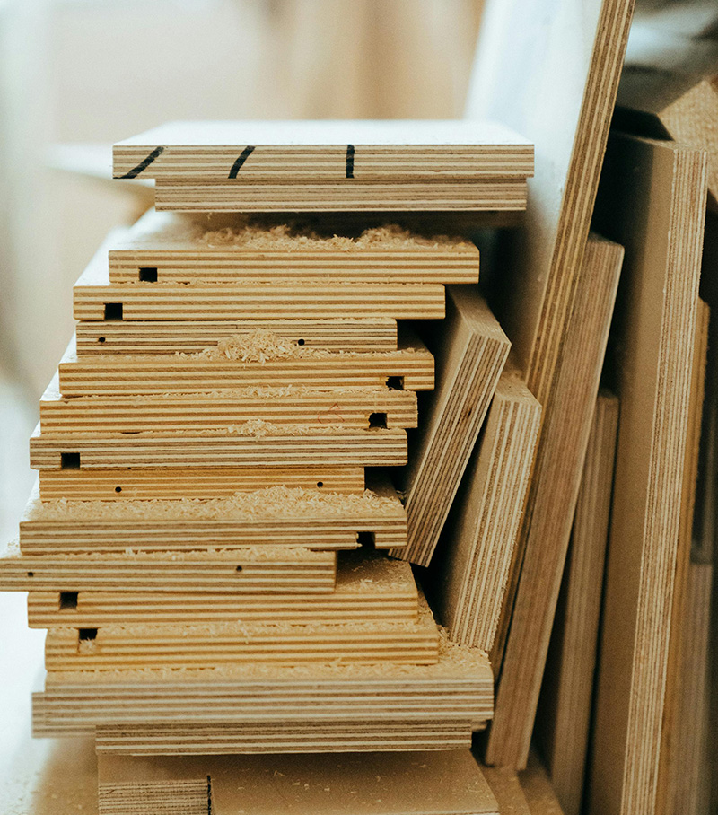 Plywood is an engineered wood product made by layering thin sheets of wood veneer, called plies, which are glued together with their grains rotated up to 90 degrees to each other. 