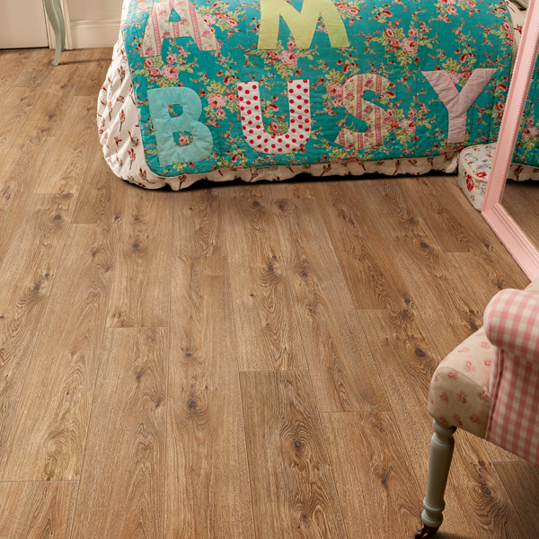 an image of herringbone laminate flooring in white kitchen